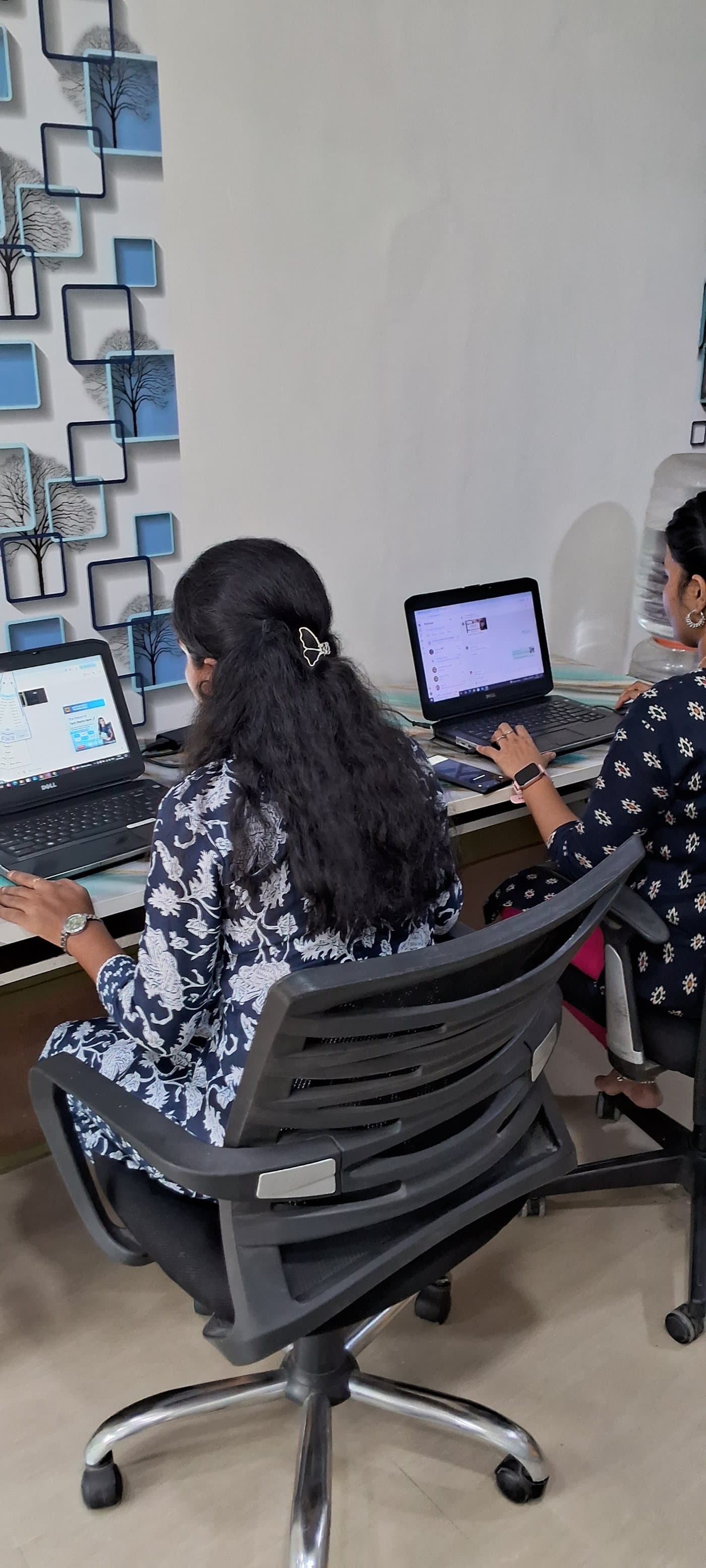 Students completing practical computer exercises at Success Root Technologies