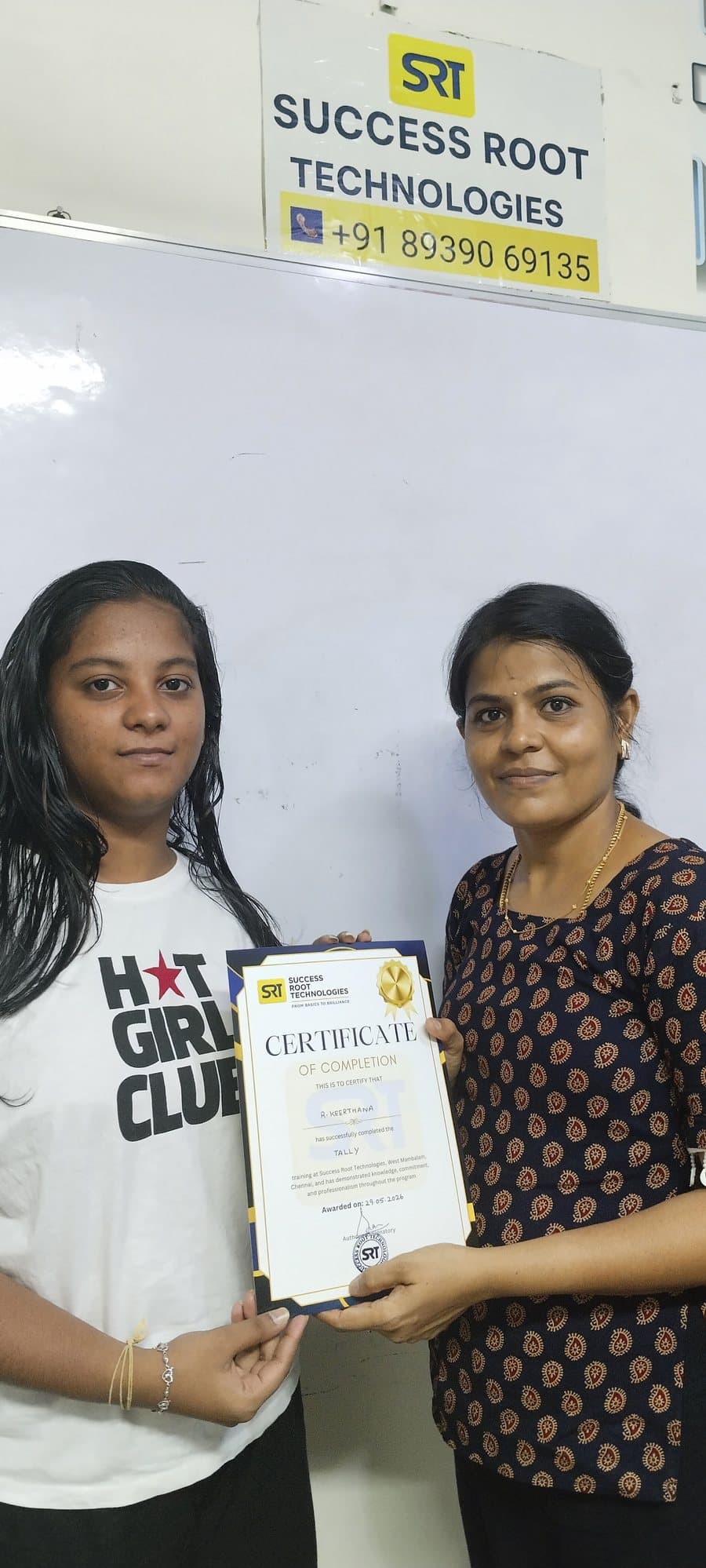 Student receiving a course completion certificate at Success Root Technologies