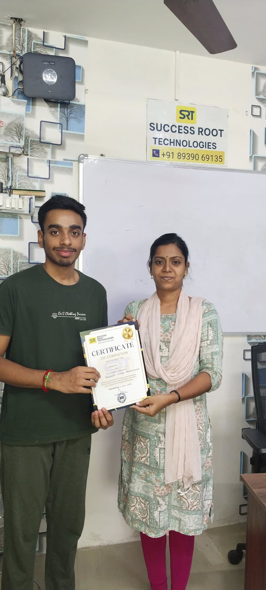 Student certificate presentation at Success Root Technologies
